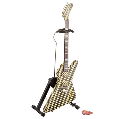 Gold and black houndstooth Axe Heaven guitar replica with stand