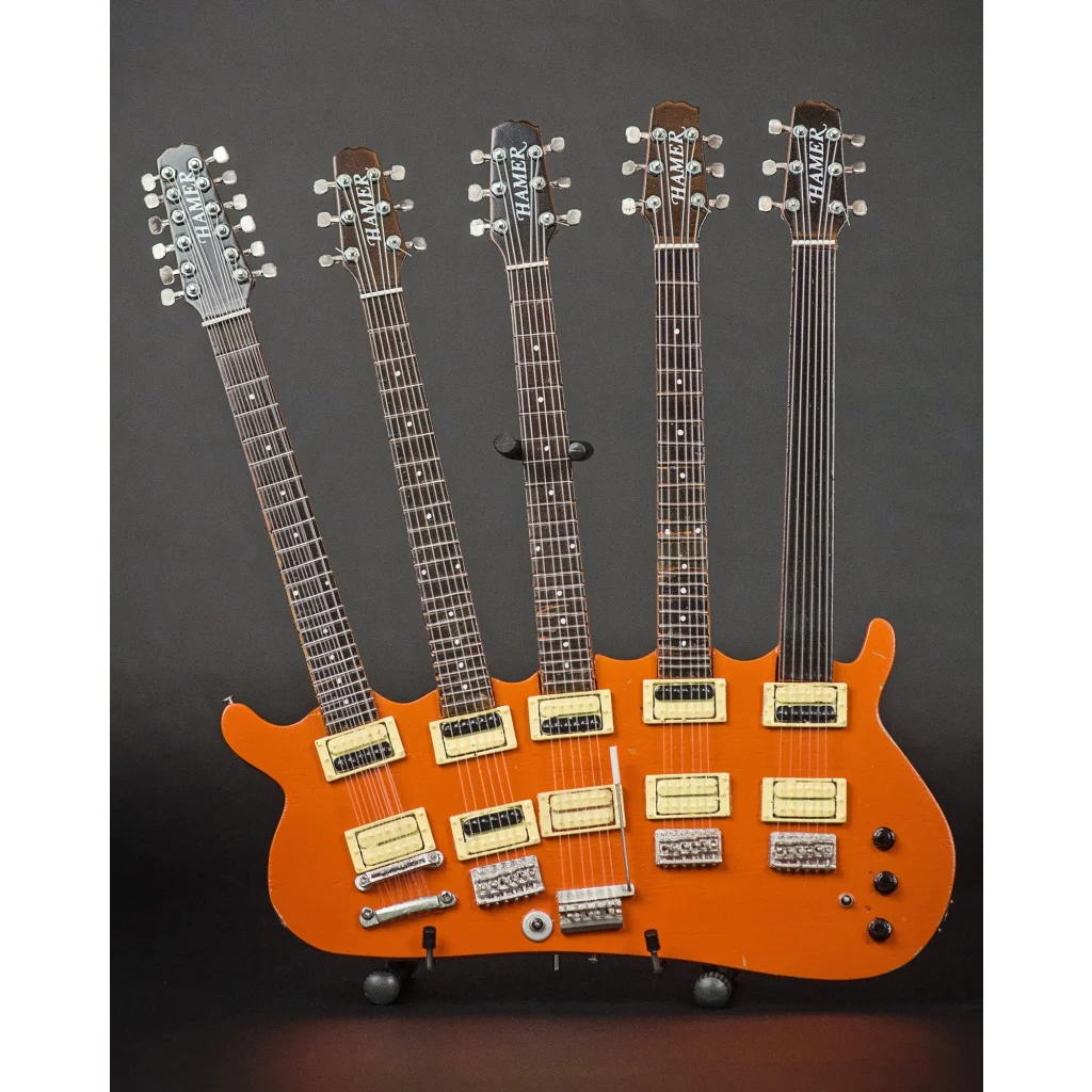 Rick Nielsen officially licensed mini guitar by Axe Heaven® with multi-neck orange body