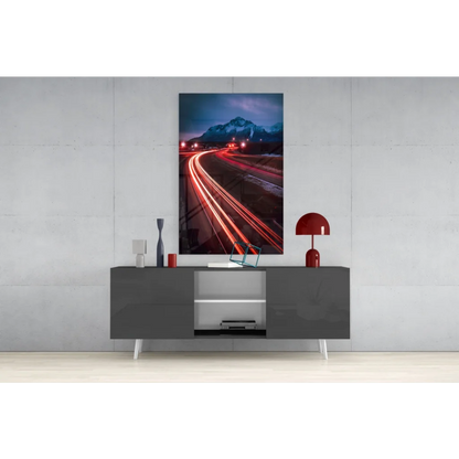 Vibrant red mushroom lamp on gray console, Mountain Highway Light Trails glass wall art