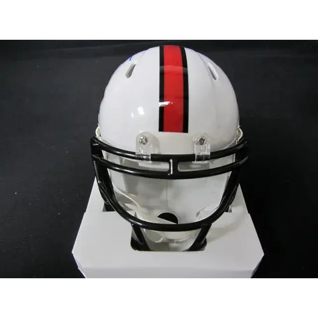 White football helmet with red and black stripe and black facemask, signed by Roger Staubach