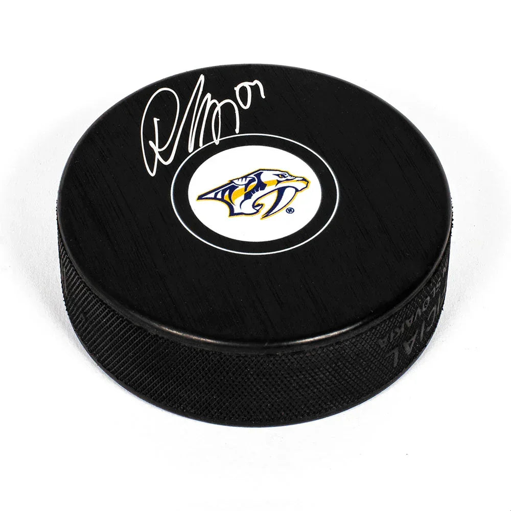 Roman Josi autographed Nashville Predators hockey puck with saber-toothed cat logo