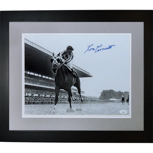 Black-and-white deluxe framed 11x14 photo of ron turcotte riding a horse signed in blue ink framed 11x14 photo