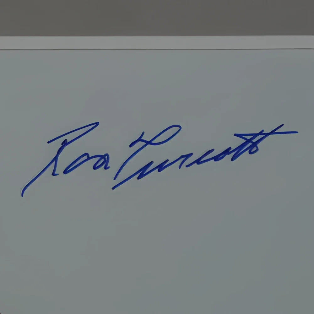 Blue ink signature of ronald reagan on light gray surface in deluxe framed 11x14 ron turcotte photo