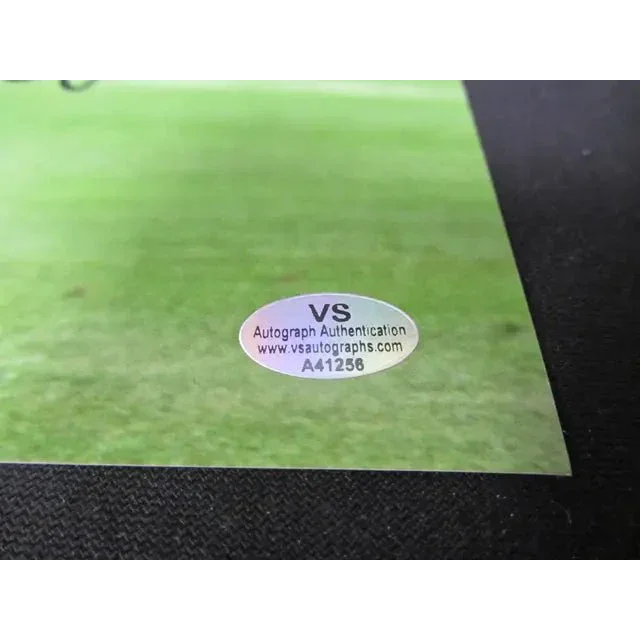 Holographic authentication sticker on light green surface for Ronald Nazario Brazil signed photo