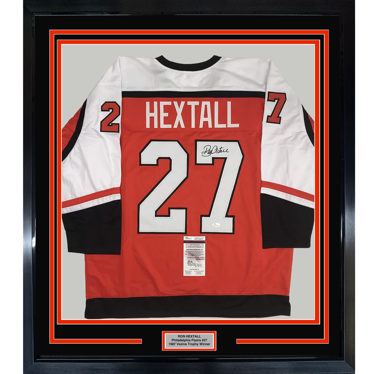 Back view of framed red, white, and black Philadelphia Flyers jersey #27 signed by Ron Hextall with JSA authentication label.