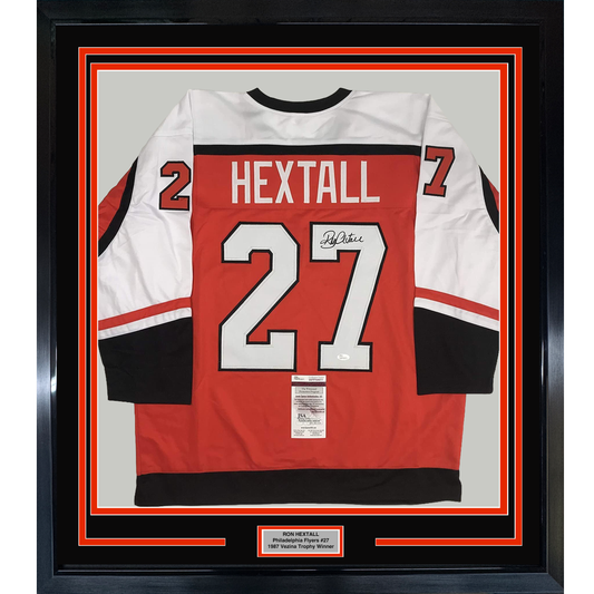 Back view of framed red, white, and black Philadelphia Flyers jersey #27 signed by Ron Hextall with JSA authentication label.