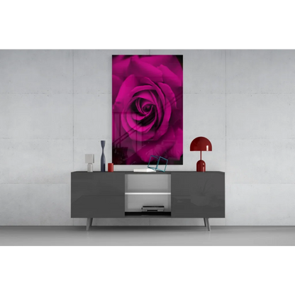 Vibrant magenta rose glass wall art on sleek gray console table