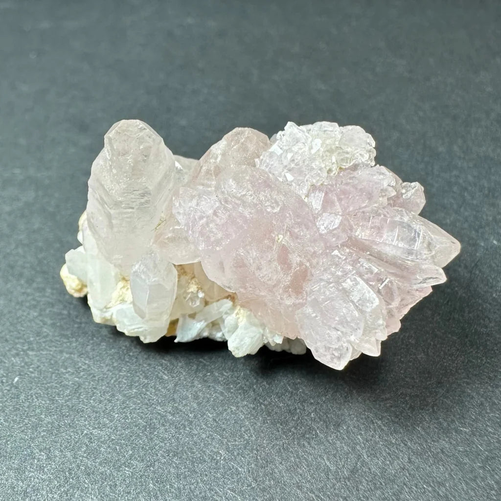 Rose quartz cluster from Brazil with translucent pink crystals