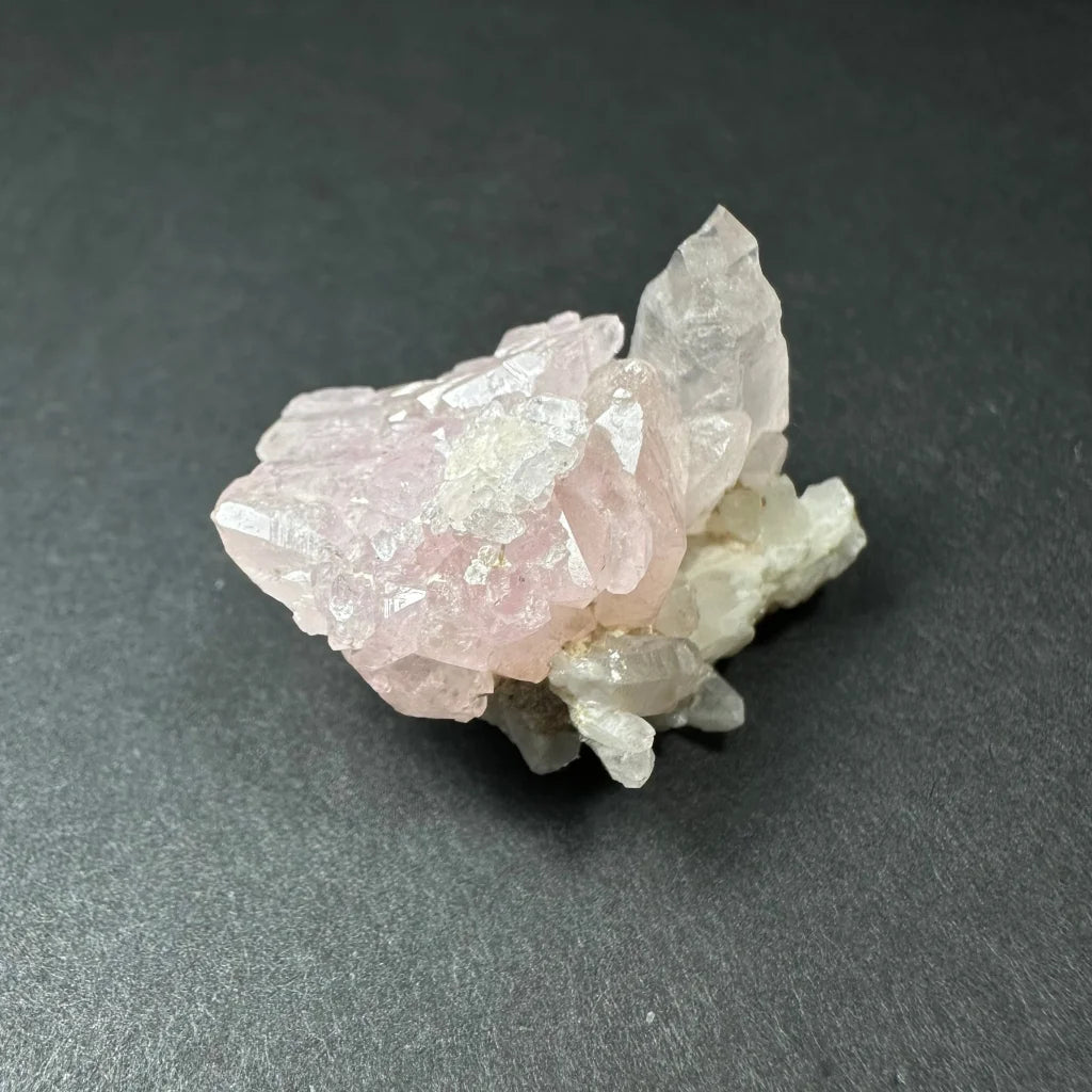 Rose quartz cluster from Brazil with translucent pink crystals