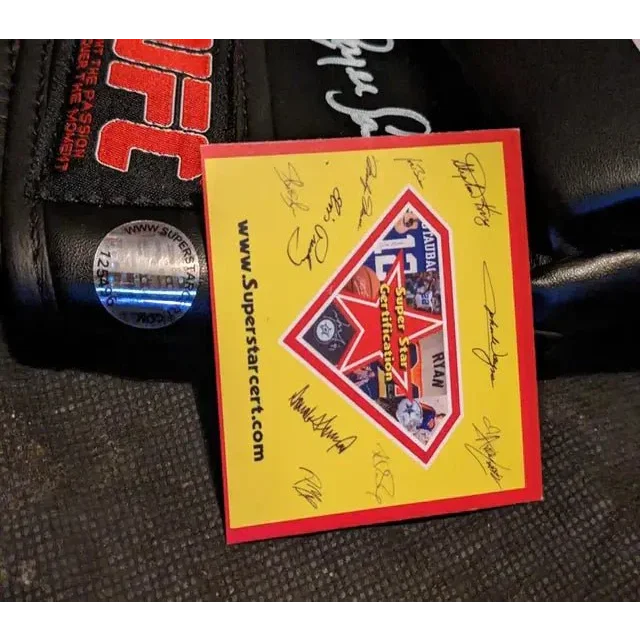 Black Royce Gracie signed UFC glove with yellow certification card for authenticity