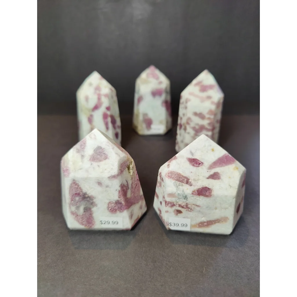 Pink and white speckled rubellite quartz polished obelisk tower sculpture with smooth polished obelisk tower surface