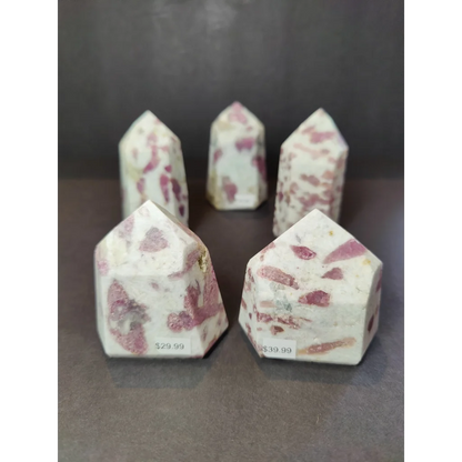 Pink and white speckled rubellite quartz polished obelisk tower sculpture with smooth polished obelisk tower surface