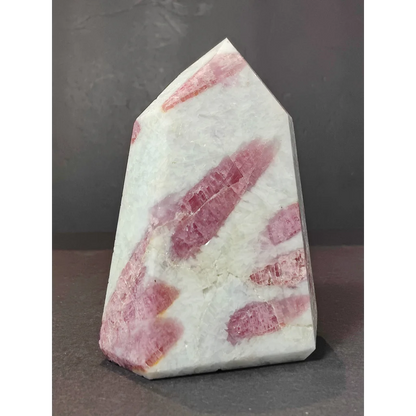 Polished pink and white rhodochrosite crystal point quartz polished obelisk tower sculpture with natural banding patterns