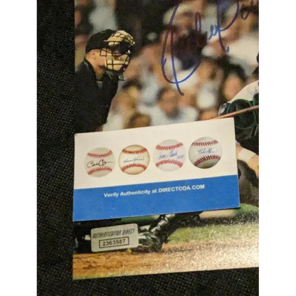 Autographed 8x10 photo of Ruben Sierra with authenticity verification and baseball memorabilia