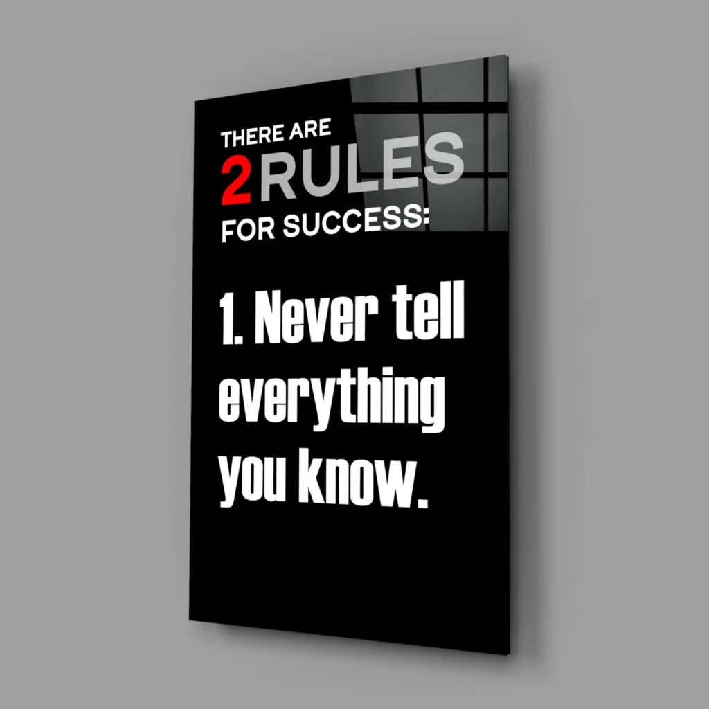 Black glossy glass wall art with bold white red text: 2 rules for success 1