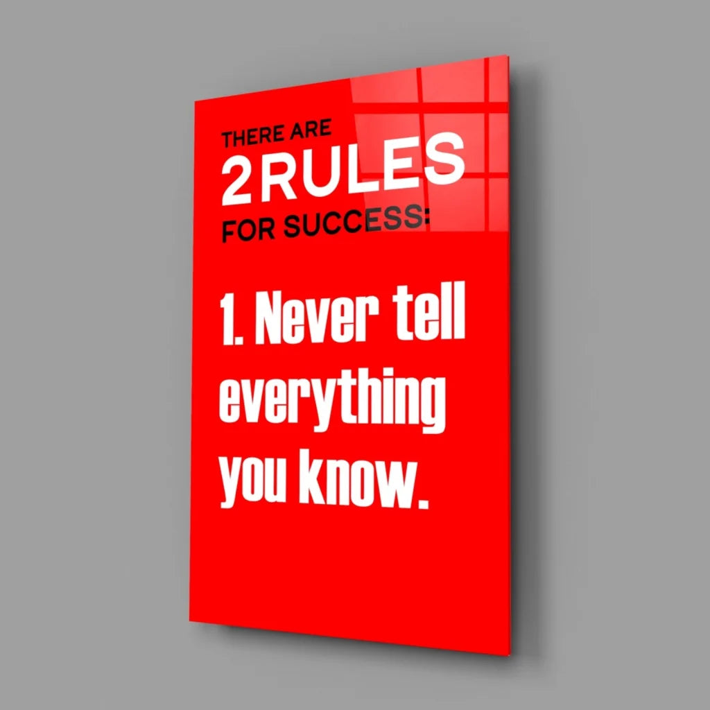 Vibrant red glass wall art with bold white text: there are 2 rules for success 1