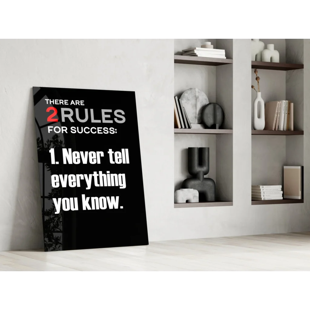 Black motivational glass wall art with bold white and red text on success rules