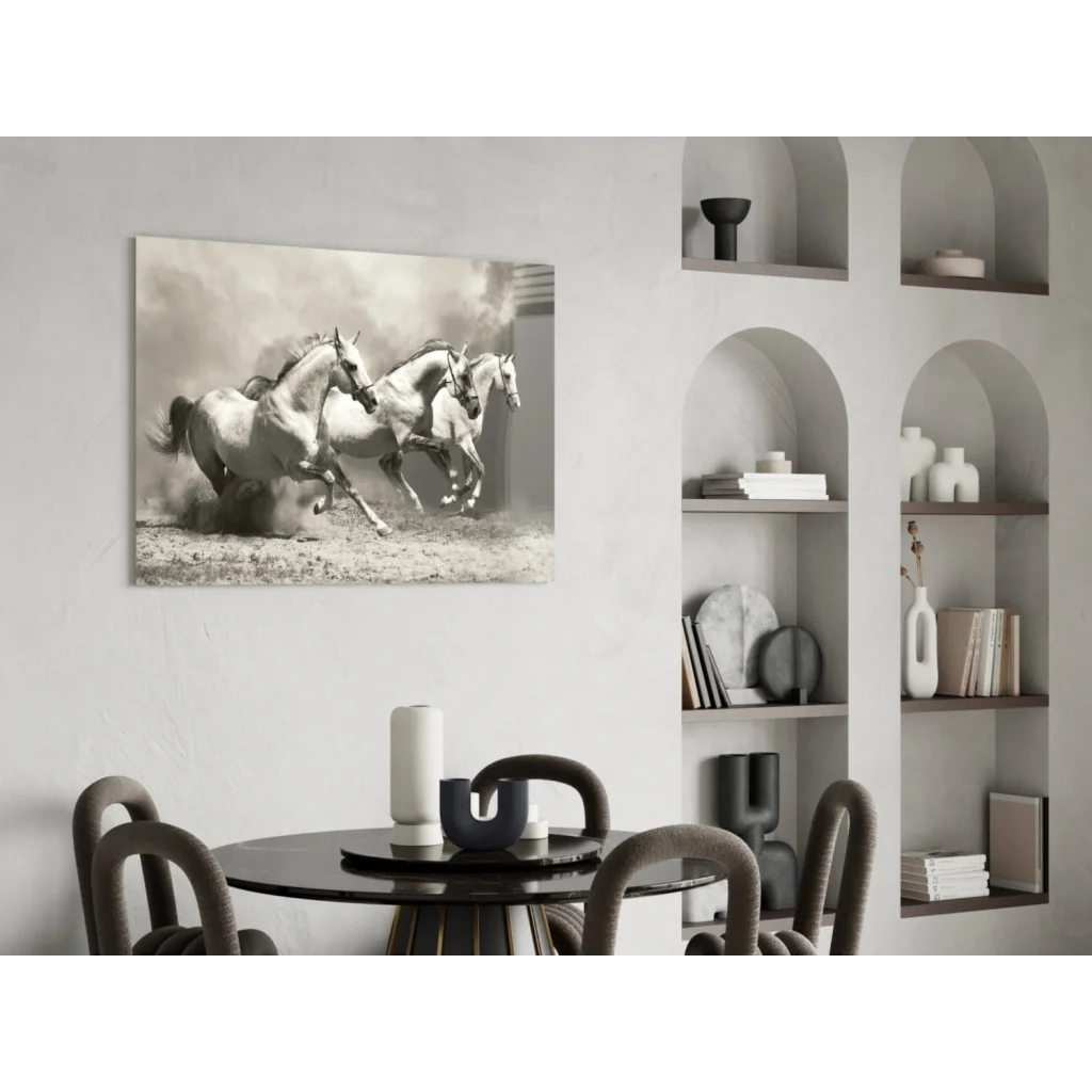 Sepia-toned canvas wall art of three galloping white horses on wall