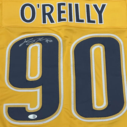 Ryan O’Reilly signed custom hockey jersey in yellow and navy with number 90