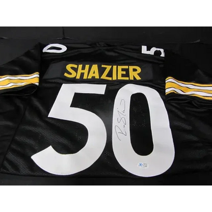 Black Pittsburgh Steelers signed jersey with white numbers, yellow lettering, autographed by Ryan Shazier