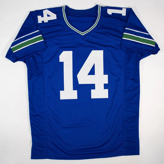 Blue Seattle Seahawks retro football jersey number 14 displayed flat against white background, showing front view with white numerals and shoulder stripes.