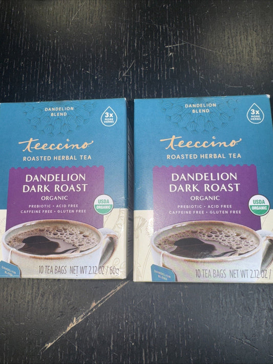 Two identical blue and purple Teeccino Dandelion Dark Roast tea boxes displayed side by side on dark wood surface.