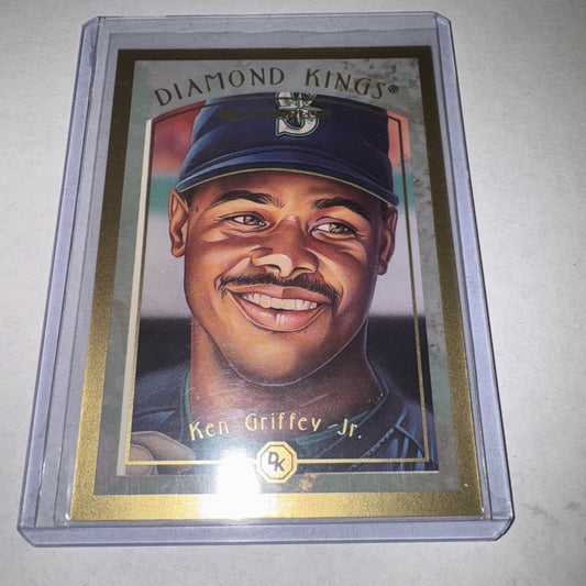 A 1997 Donruss Diamond Kings Ken Griffey Jr. baseball card in a clear protective case, displaying a portrait illustration of the player wearing a Seattle Mariners cap.