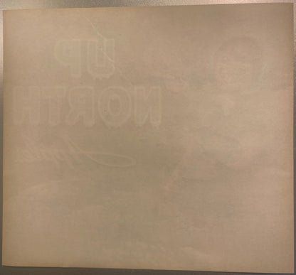 Back of the Up North crate label: plain toned paper with the Up North lettering and the picture showing faintly through in reverse