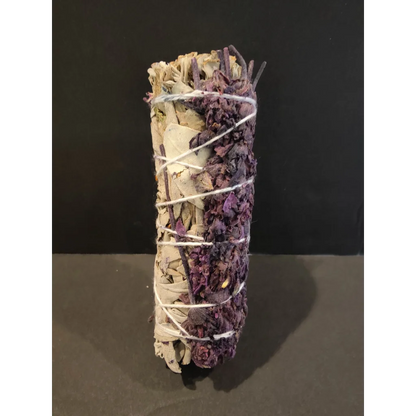 4-inch sage bundle smudge stick with dried sage and purple flowers tied in white twine