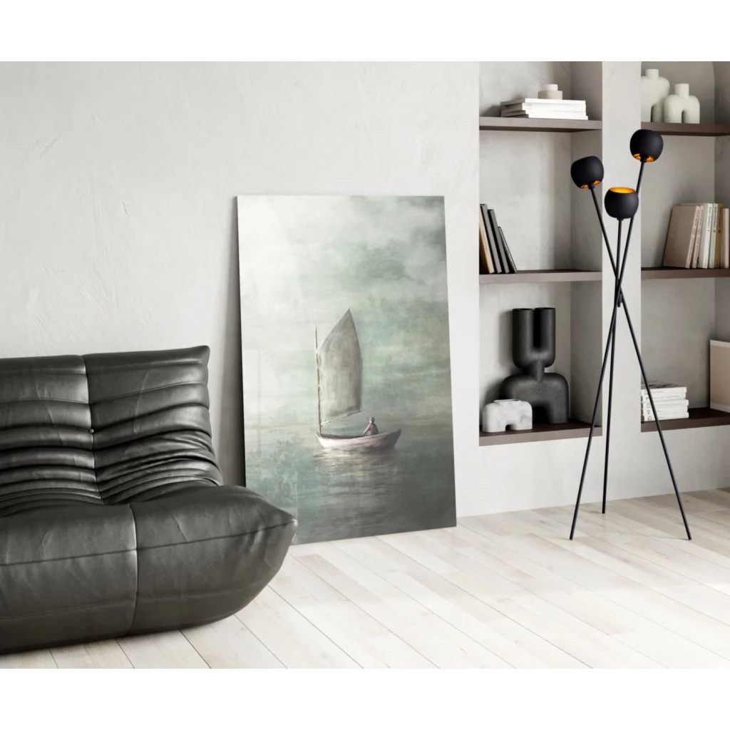 Modern sailboat wall art over black leather sofa