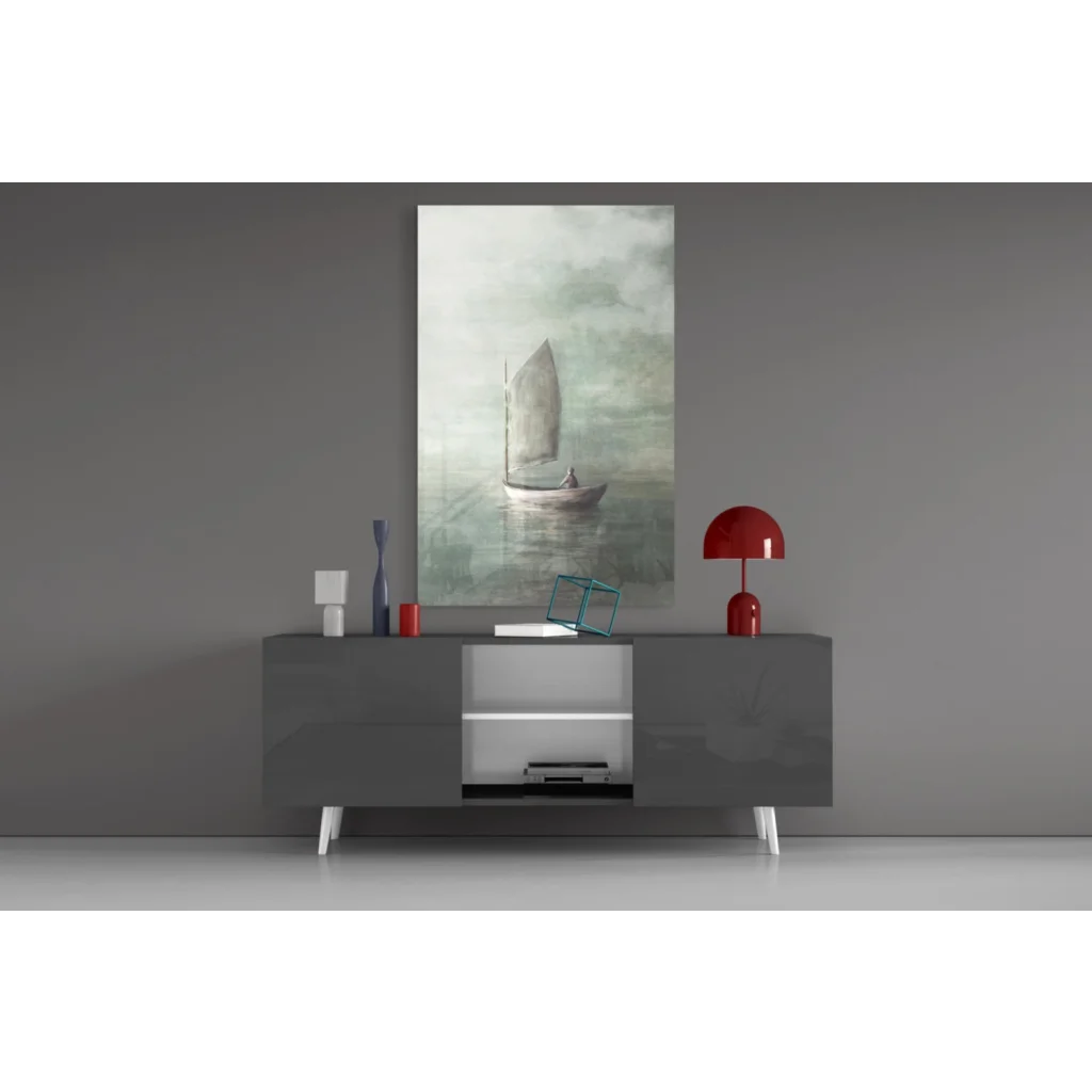 Modern gray sideboard with white legs under sailboat wall art