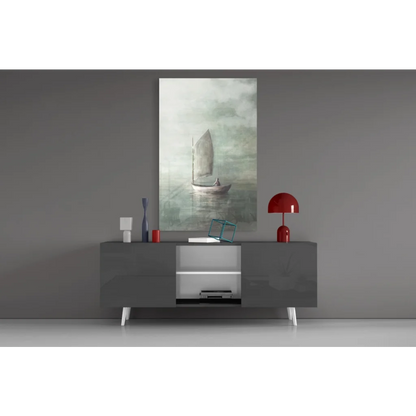 Modern gray sideboard with white legs under sailboat wall art