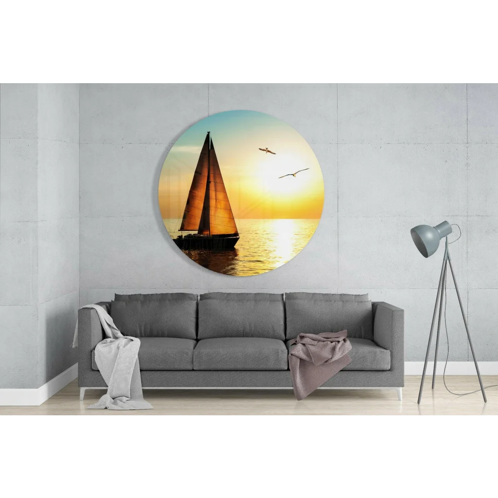 Sunset sailboat tempered glass art on concrete wall