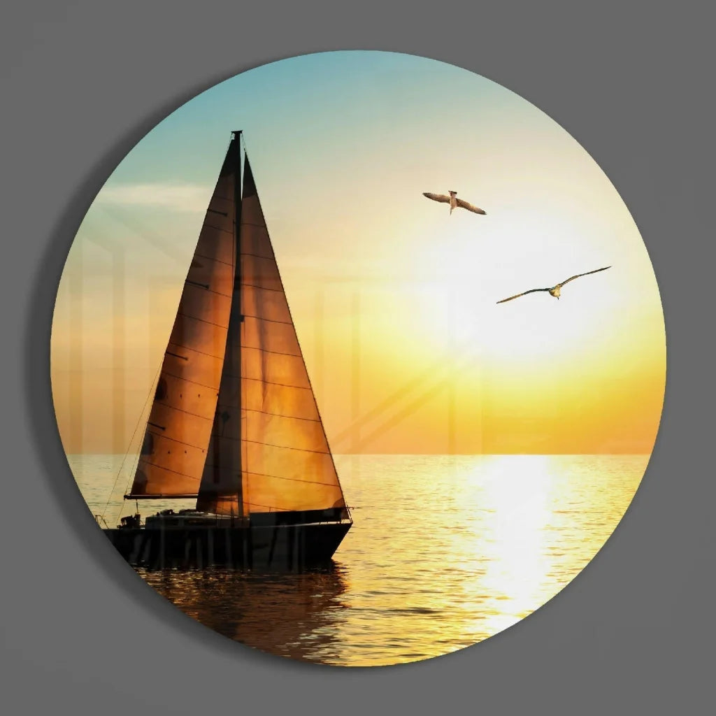 Circular tempered glass art of sailboat at golden sunset with seagulls