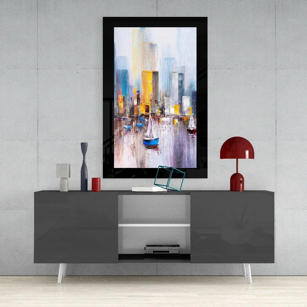 Vibrant abstract cityscape glass wall art with blue sailboat in black frame