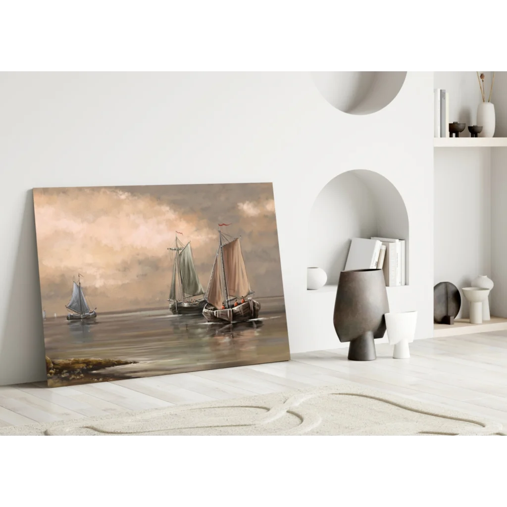 Framed glass wall art of three sailboats on misty sea under pink skies