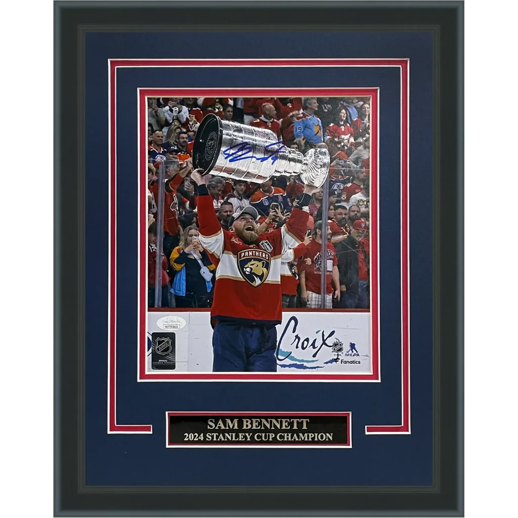 Sam Bennett holds Florida Panthers Stanley Cup trophy in signed photo