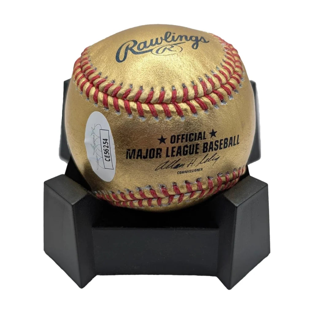 Sammy Sosa signed Rawlings authentic gold baseball with red stitching on black stand