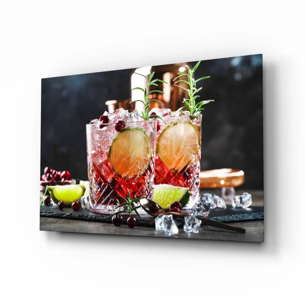 Red and brown cocktail glasses with ice and lime on Samsung QLED TV glass wall art
