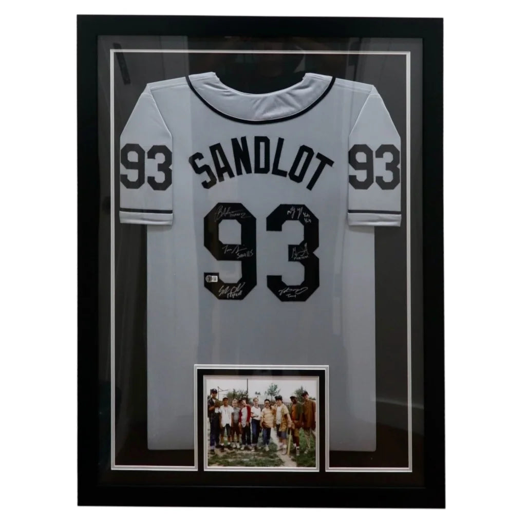 Back side of a framed grey custom baseball jersey with black sandlot cast autographed lettering and number 93