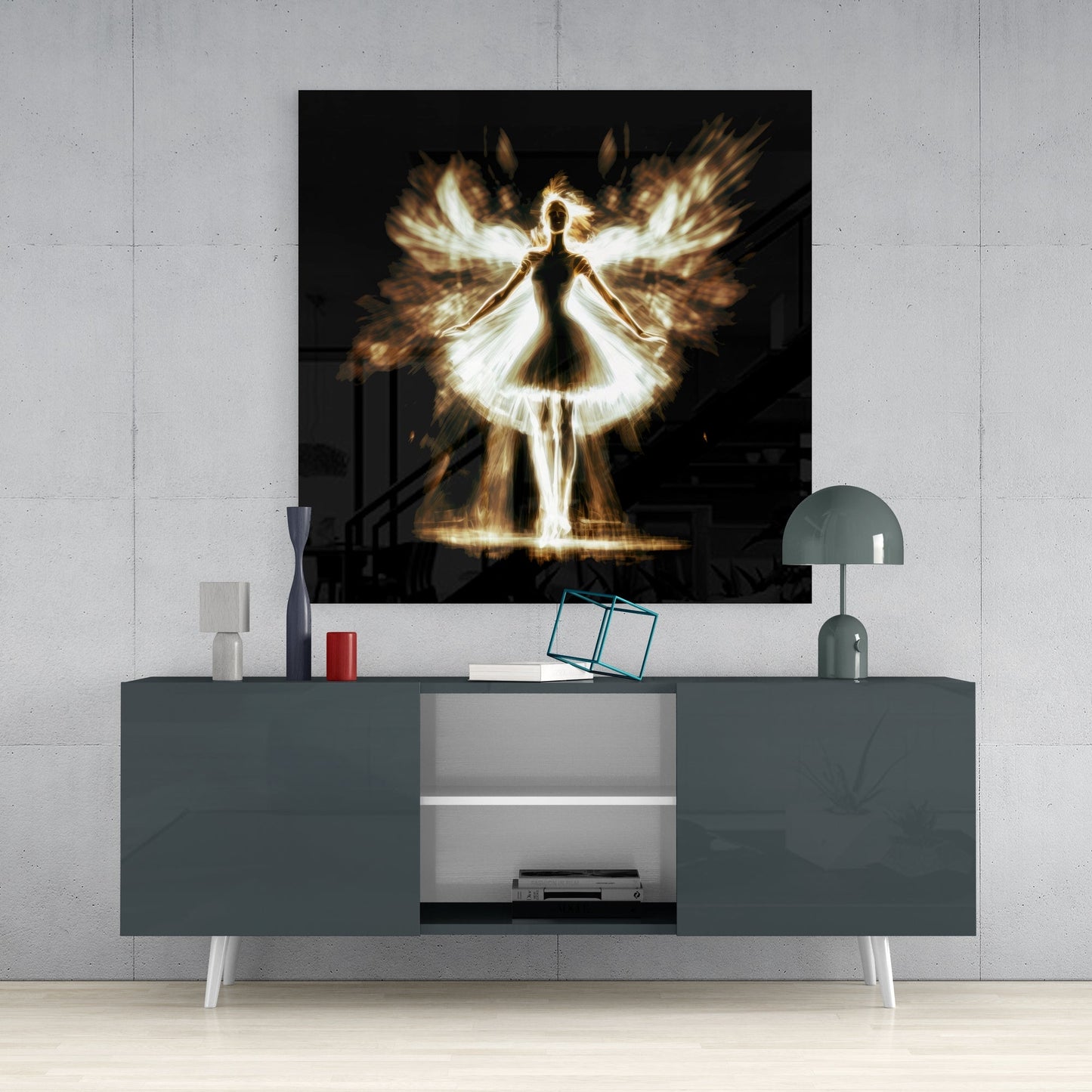 Flame Dancer Glass Wall Art displayed above a gray media console with decorative items and a lamp in a modern interior setting.