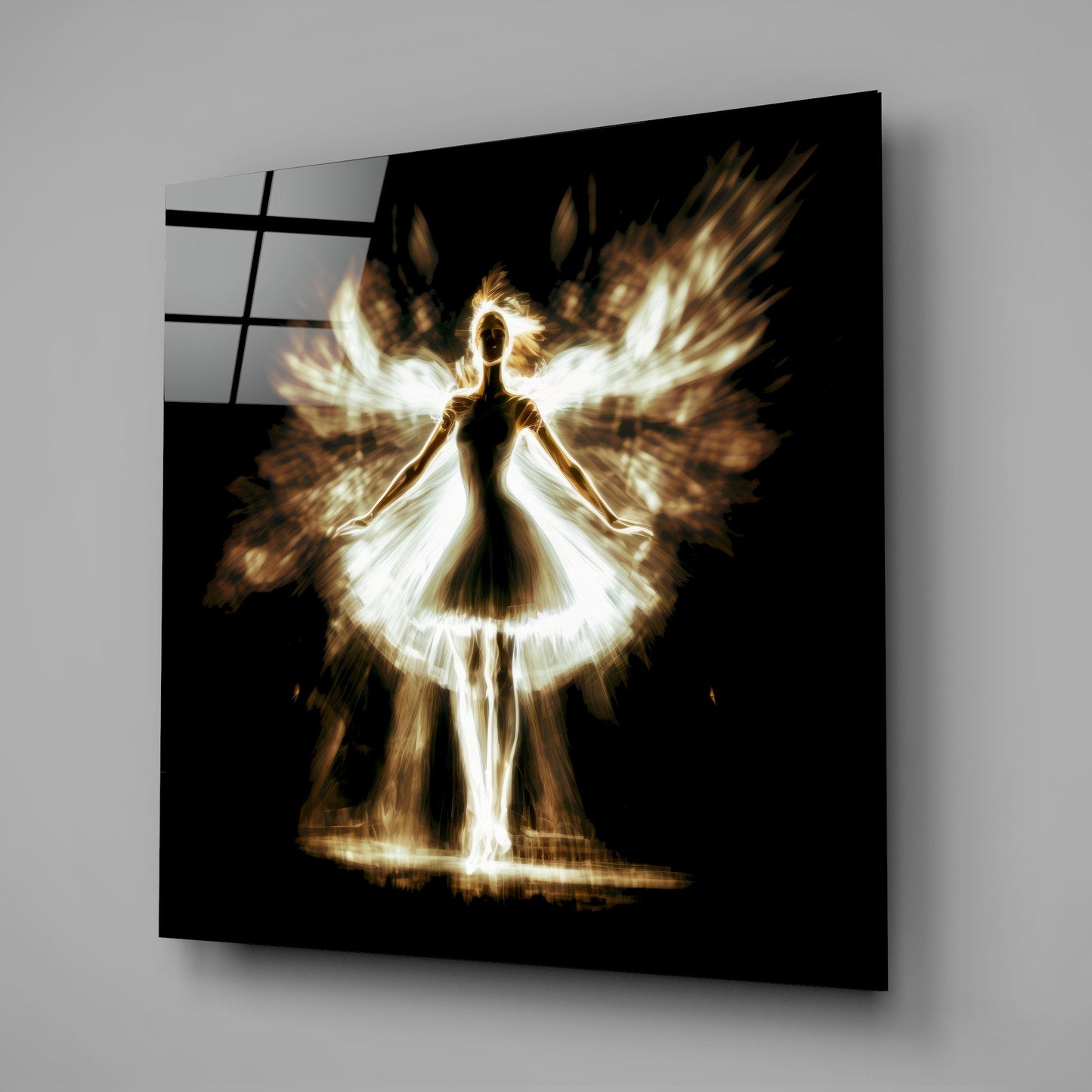 Angled view of a black glass wall panel displaying a glowing golden and white silhouette of a winged figure against darkness.
