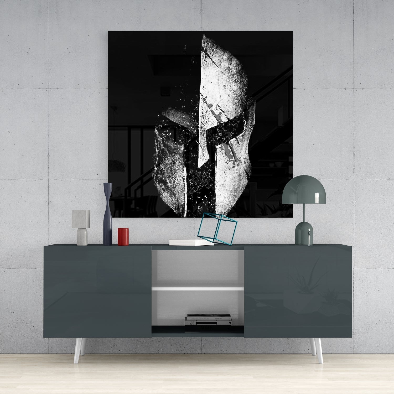 Black and white glass wall art featuring a Spartan helmet displayed above a gray media console in a minimalist interior setting.