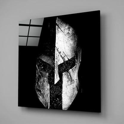 Black and white glass wall art displaying a split face design with geometric patterns and window grid detail in upper left corner.