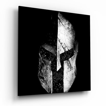 Black and white glass wall art depicting a split Spartan helmet design with white textured surface against dark background.