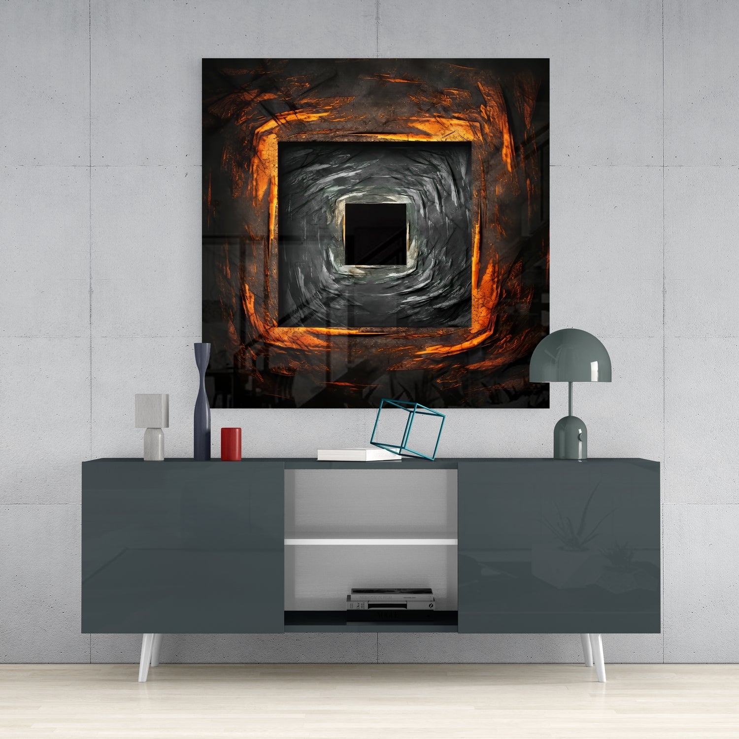 Square hole glass wall art with concentric orange and black swirling pattern displayed above gray media console in modern interior.