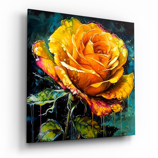 Glass wall art panel displaying a vibrant yellow and orange rose with dripping paint effect against a dark teal background, shown at an angled perspective.
