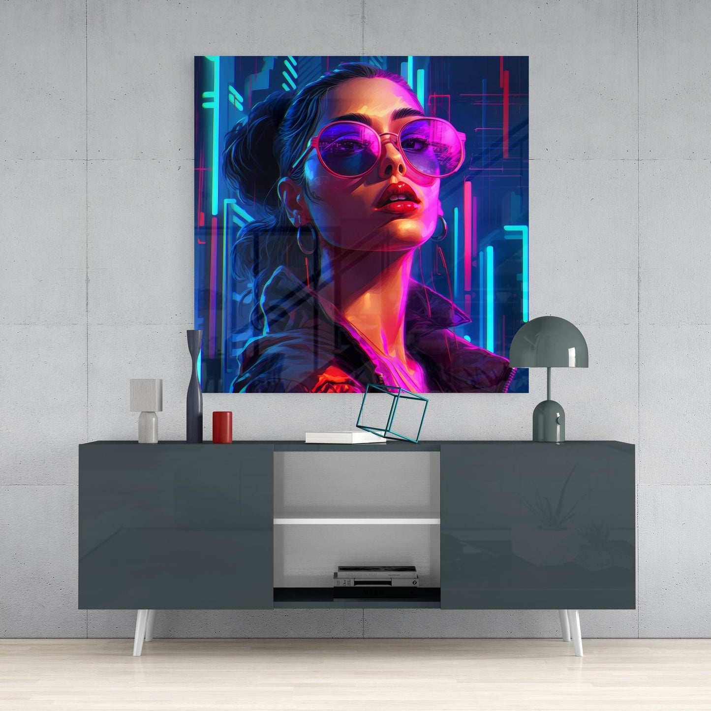 Neon-lit portrait of young woman wearing pink sunglasses displayed as glass wall art above gray media console.