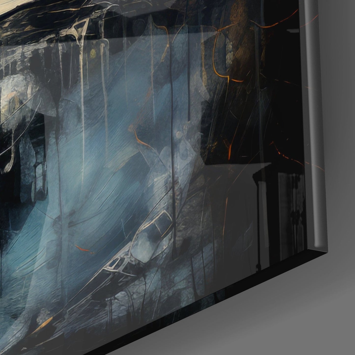 Angled view of glass wall art displaying moody nighttime street scene with parked cars, blue-grey tones, and orange light streaks, mounted on grey wall.
