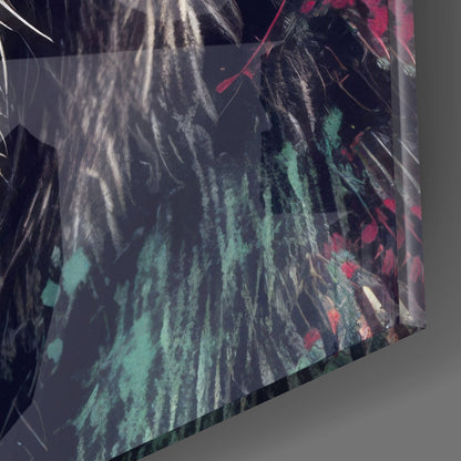 Angled close-up of glass wall art showing layered translucent panels with green, red, and white brushstroke patterns against dark background.